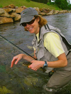 Charity taught author Mary Alice Monroe the high sticking method at the Brookside Guides Womenâ€™s Fly Fishing School at Lake Logan, North Carolina