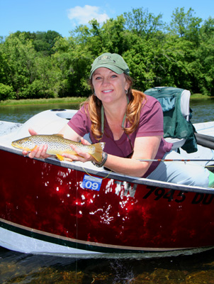 Charity hooked this brown trout on a dry fly