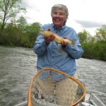 Angler with a Tuckaseegee River brown trout