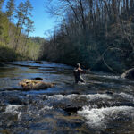 Fly fishing guide Ian Rutter casts nymphs into a Smoky Mountain stream